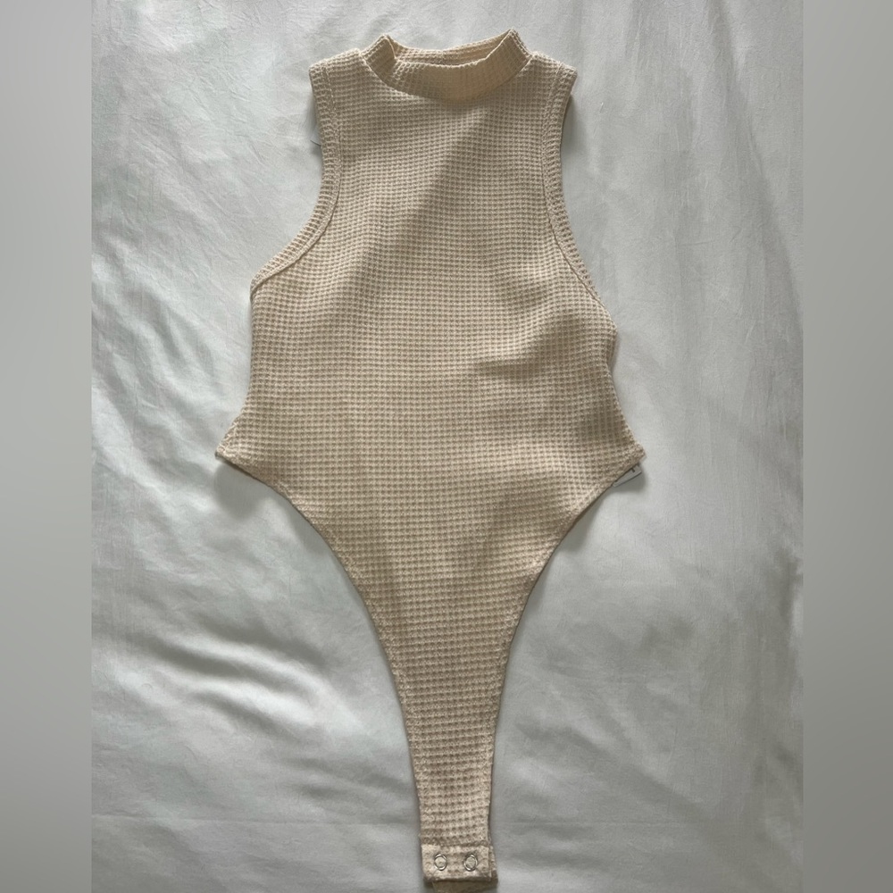 Forever 21, size small, beige nude bodysuit. Never used, tag still on it.